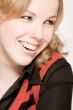 Portrait of a laughing blond curly woman