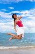 in the air leap by the beach