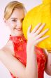 smiling girl holding a yellow chinese lantern