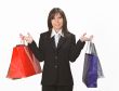 Smiling woman with shopping bags