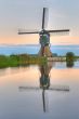 Dutch windmill in quiet waters