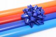 Colorful wrapping paper and a gift bow