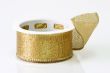 A spool of golden girft wrapping ribbon