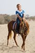 Girl riding on the beach