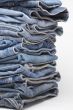 the heap of modern designer blue jeans