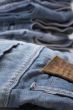 the heap of modern designer blue jeans
