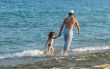  father and the daughter on a beach