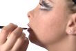 Make up artist applying lipstick