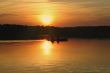 kayakers against summer sunset