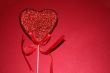 Red heart on red background
