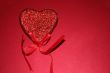 Red heart on red background