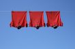 Laundry, three red t-shirts