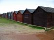 A row of beach huts during the winter months.