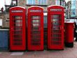 Three telephone boxes and post box