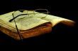 old book with a glasses