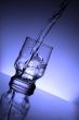 The water flowing into a glass