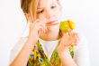 Young girl painting an easter eggs