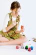 Young girl painting her easter eggs