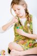 Young girl with green paint