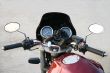 Part of a claret motorcycle.