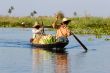 burmese women in wooden canoe