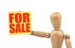 figure holding a sale announcement