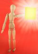 wooden figure with empty note