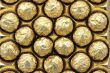 Chocolate sweets in golden foil