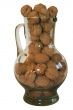 Handful of walnuts in a glass decante