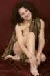 Beautiful naked woman on a dark background.