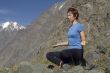 Meditating girl in the mountains 03