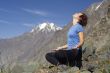 Meditating girl in the mountains 04