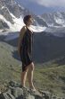 Girl in a black dress in the mountains