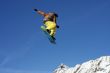 Snowboarder jumping high in the air