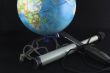 globe and a spyglass
