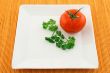 Tomato and parsley on a square plate