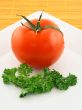 Fresh tomato and parsley on a plate