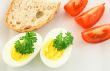 Simple meal. Eggs, bread and tomatos.