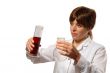 young lady scientist pours liquid