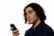 Young man texting on mobile phone