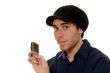 Young man texting on mobile phone