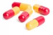 red and yellow capsule pills isolated