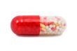 red and white capsule pill isolated