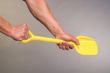 Strong hands and children`s shovel