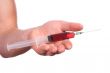 Hand with a syringe