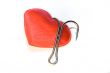 Red heart with a fishing hook on a white background