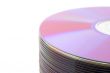 Close-up of stacked purple DVDs