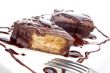 Two chocolate cakes with syrup and the fork