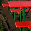 red summer party tables and red chairs