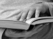 hands with book